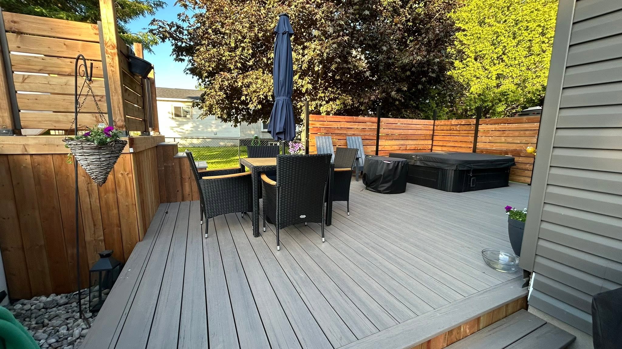 Deck with patio seating and wood privacy screens.