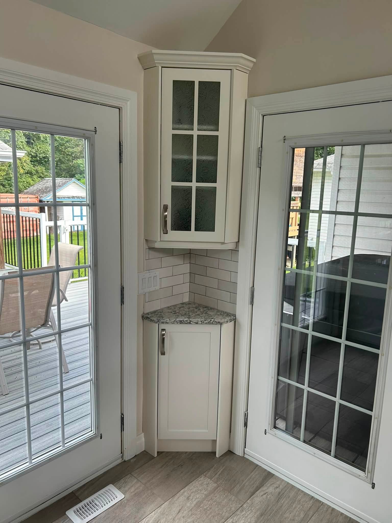 Wood Effects kitchen cabinetry beside a sliding patio door