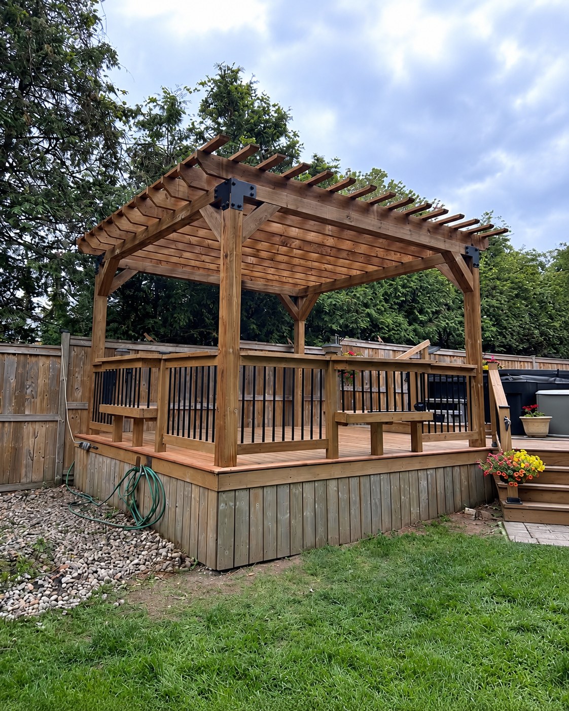 Raised deck and timber pergola viewed from the backyard.
